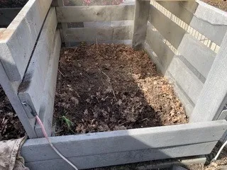 Photo of a wooden compost bin