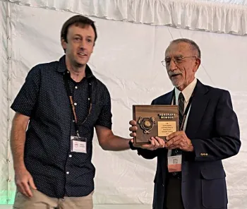 UC Davis Distinguished Emeritus Professor Howard Ferris (right) receives his Honorary Member award at the Society of Nematologists' meeting. With him is awards presenter Nathaniel Schroeder of Crops Science, University of Illinois, Urbana-Champaign. (SON Photo)