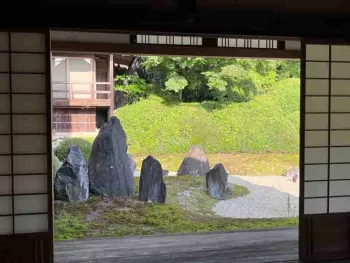 Garden scene framed by building doorway at Komyo-in temple, Kyoto. J.C. Lawrence