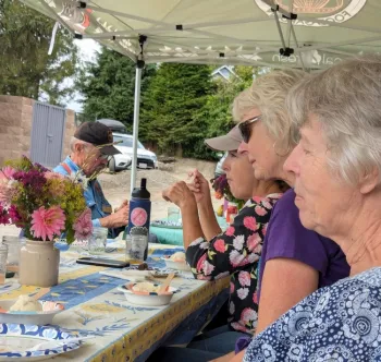 Group of people sitting at a table.
