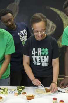 In the Cooking Academy, teens teach younger youth how to make healthy recipes.