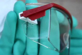 A close up of safety glasses showing Z87 marked on the side.