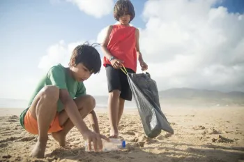 Youth cleaning beach