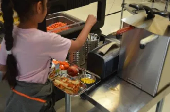 Blacow Elementary student taking reusable utensils to eat their school lunch, October 2023.