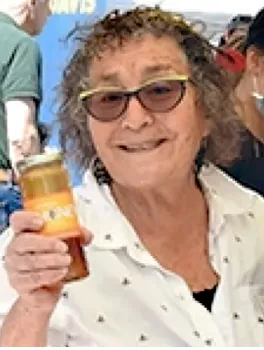 Amina Harris, co-founder of the California Honey Festival, with a jar of. honey. (Photo by Kathy Keatley Garvey)