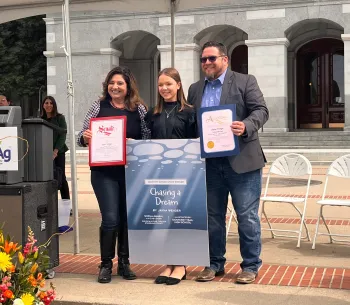 Jayna posing with her regional legislators