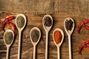 5 Wooden spoons with dried spices