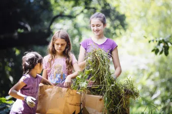 Kids participating in a 4-H earth day clean up 