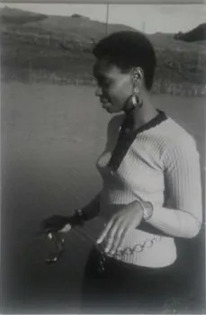 Black and white photo of young woman outside