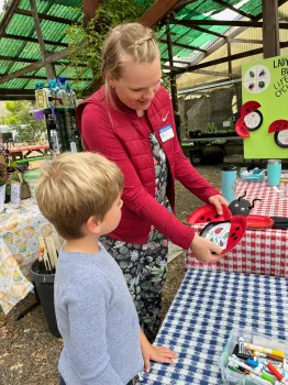Adult teaching a child about insect anatomy