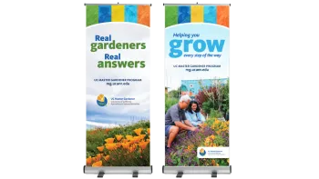 Two UC Master Gardener Program retractable banners reading "Real gardeners. Real answers." and "Helping you grow every step of the way." with mg.ucanr.edu.