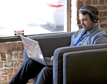 Man with laptop at Apps for Ag Hackathon event