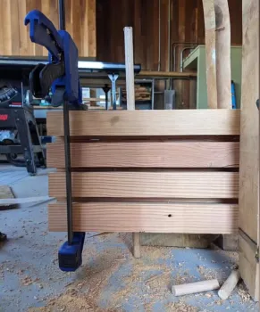 DLT with a dowel inserted through panels of wood