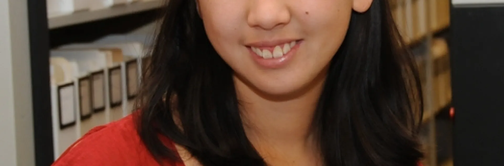 NEW BROOCH--Nanase Nakanishi, a UC Davis student who plans to become a veterinarian, cares for this rose-haired tarantula at the Bohart Museum. It's one of the live insects in the museum, which houses more than seven million specimens. (Photo by Kathy Keatley Garvey)