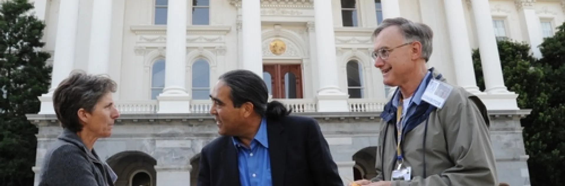 CALIFORNIA SECRETARY OF AGRICULTURE A. G. Kawamura (center) greets Lynn Kimsey, director of the Bohart Museum of Entomology and professor and vice chair of the UC Davis Department of Entomology. At right is Extension apiculturist Eric Mussen, also a member of the UC Davis entomology faculty and parliamentarian of the California State Beekeepers' Association. (Photo by Kathy Keatley Garvey)