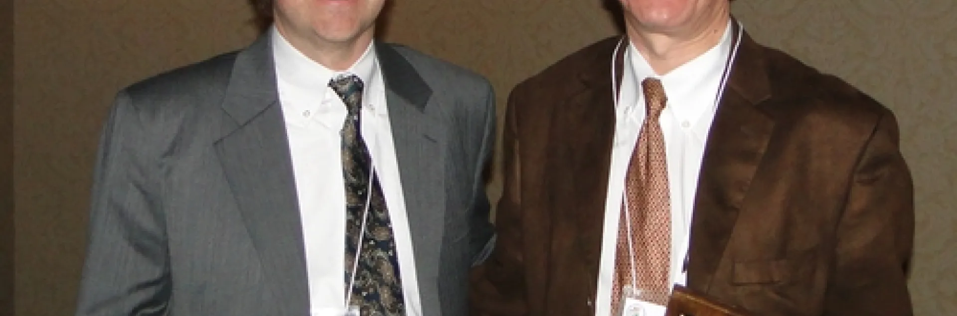 CHEMICAL ECOLOGIST Walter Leal (right) is the 2010 recipient of the prestigious C. W. Woodworth Award, presented by Woodworth's great-grandson Brian Holden (left) at the 94th annual meeting of the Pacific Branch of the Entomological Society of America. (Courtesy Photo)