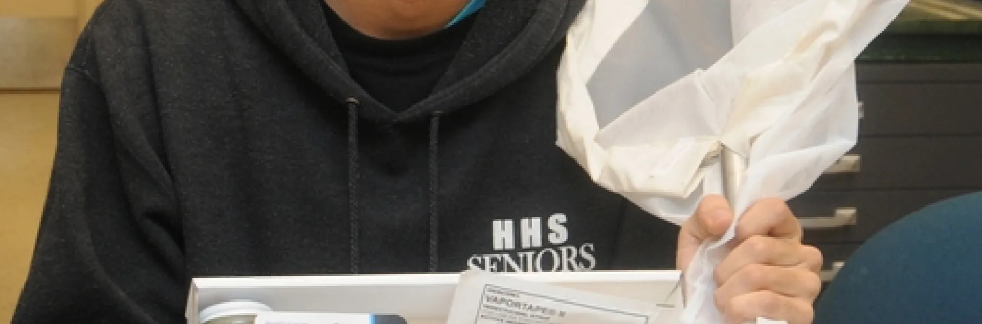 UC DAVIS entomology major Joel Hernandez, a student assistant at the Bohart Museum of Entomology, shows one of the insect collection kits available in the gift shop. Martha Stewart listed the Bohart Museum insect collection kit as one of the top three gifts to get young naturalists. Hernandez acquired one at age 7. (Photo by Kathy Keatley Garvey)