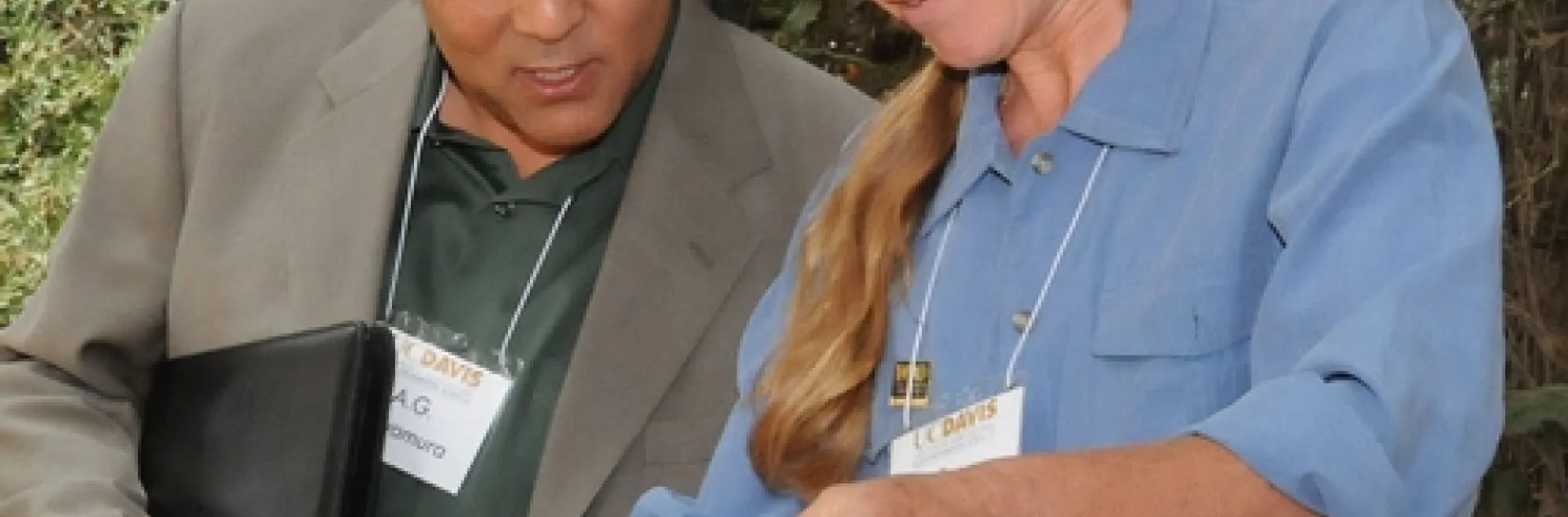 BEE BREEDER-GENETICIST Susan Cobey shows A. G. Kawamura, secretary of the California Department of Food and Agriculture, her line of New World Carniolans during his recent visit to the Harry H. Laidlaw Jr. Honey Bee Research Facility at the University of California, Davis. In his youth, Kawamura reared bees. (Photo by Kathy Keatley Garvey)
