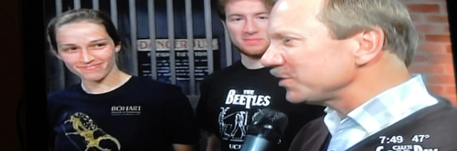 UC DAVIS Department of Entomology faculty member Larry Godfrey (right) answers questions about bugs. Behind him are Meredith Cenzer and Matan Shelomi. (Photo of Good Day Sacramento TV screen by Kathy Keatley Garvey)