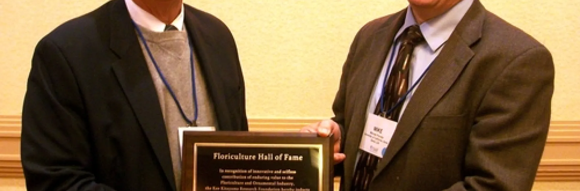 HALL OF FAME--Michael Parrella (right), professor and chair of the UC Davis Department of Entomology, was inducted into the California Floriculture Hall of Fame on Feb. 25 in San Diego. With him is presenter Mike Mellano Sr., of Mellano & Company, Oceanside. Mellano was inducted into the Floriculture Hall of Fame in 1990. (Photo Courtesy of Debi Aker)