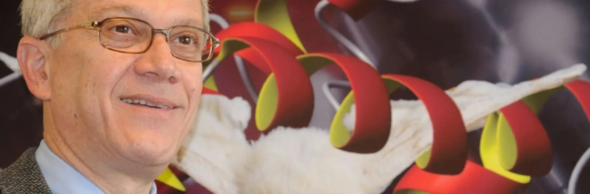 Chemical ecologist Walter Leal in front of a silkworm moth depiction. (Photo by Kathy Keatley Garvey)