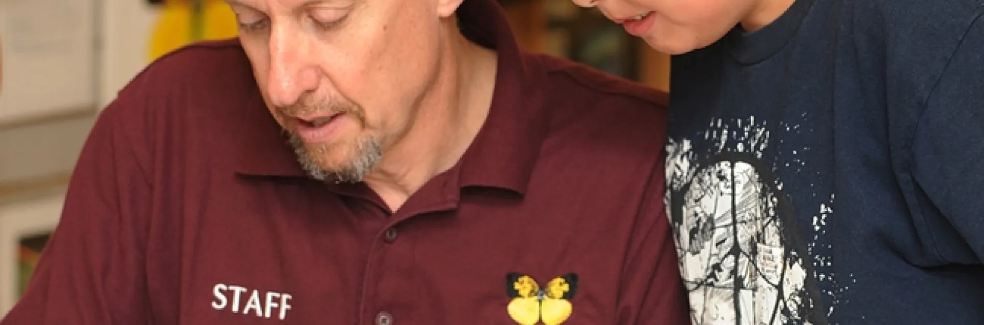 Senior museum scientist Steve Heydon shows his son, James, 10, around the Bohart Museum of Entomology. (Photo by Kathy Keatley Garvey)