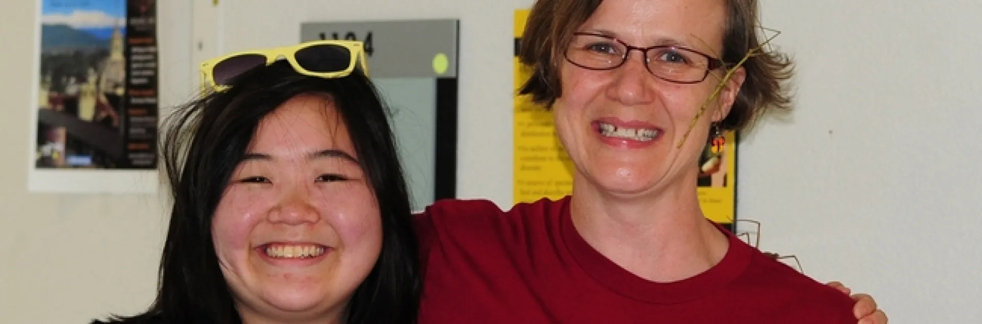 Ivana Li (left) and Fran Keller wearing their "Know Your Sticks" t-shirts. Note the real walking stick insects. (Photo by Kathy Keatley Garvey)