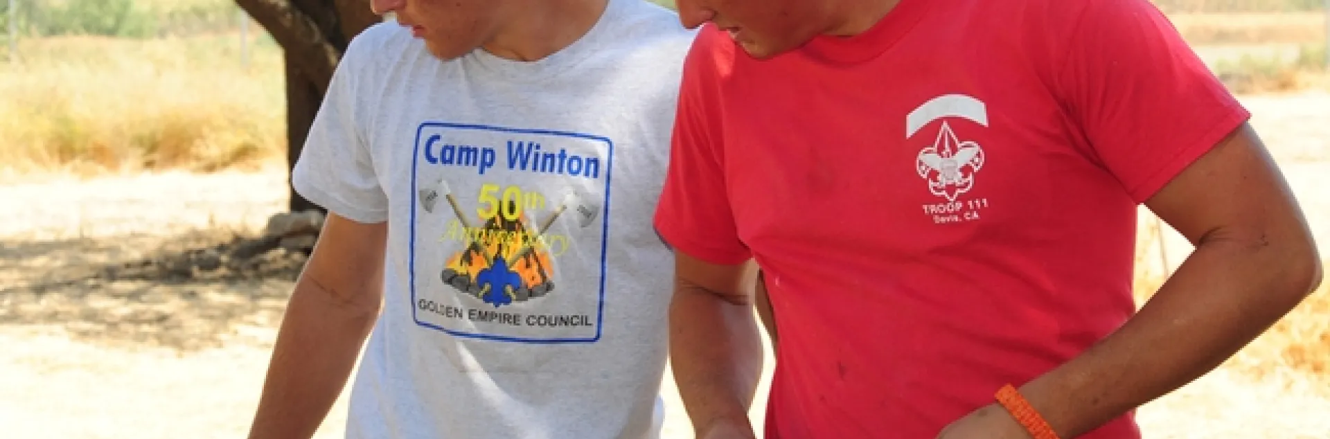 Derek Tully (right) and fellow scout Willie Hawkins work on the fence surrounding the half-acre pollinator garden. (Photo by Kathy Keatley Garvey)