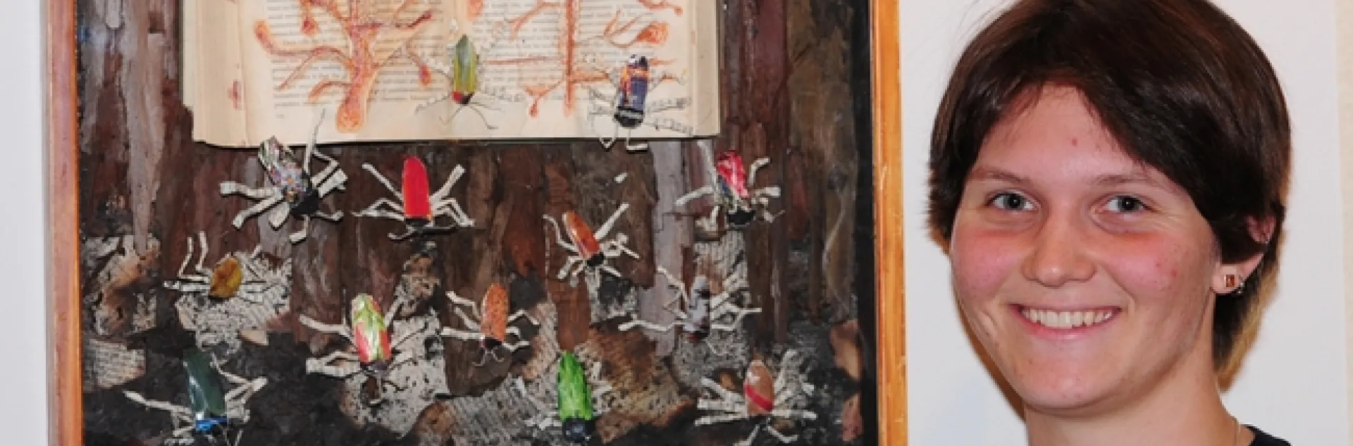 Whitney Krupp with her beetle art work. (Photo by Kathy Keatley Garvey)