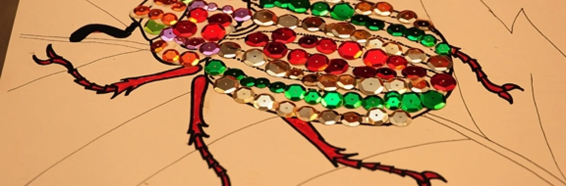 A jeweled beetle, part of the arts and crafts activity. (Photo by Kathy Keatley Garvey)