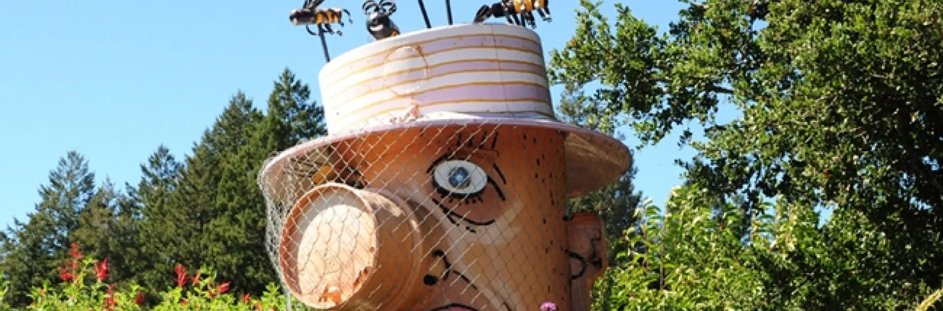 A sculpture of Bernard the Beekeeper graces the entrance to Melissa's Garden, Healdsburg. (Photo by Kathy Keatley Garvey)