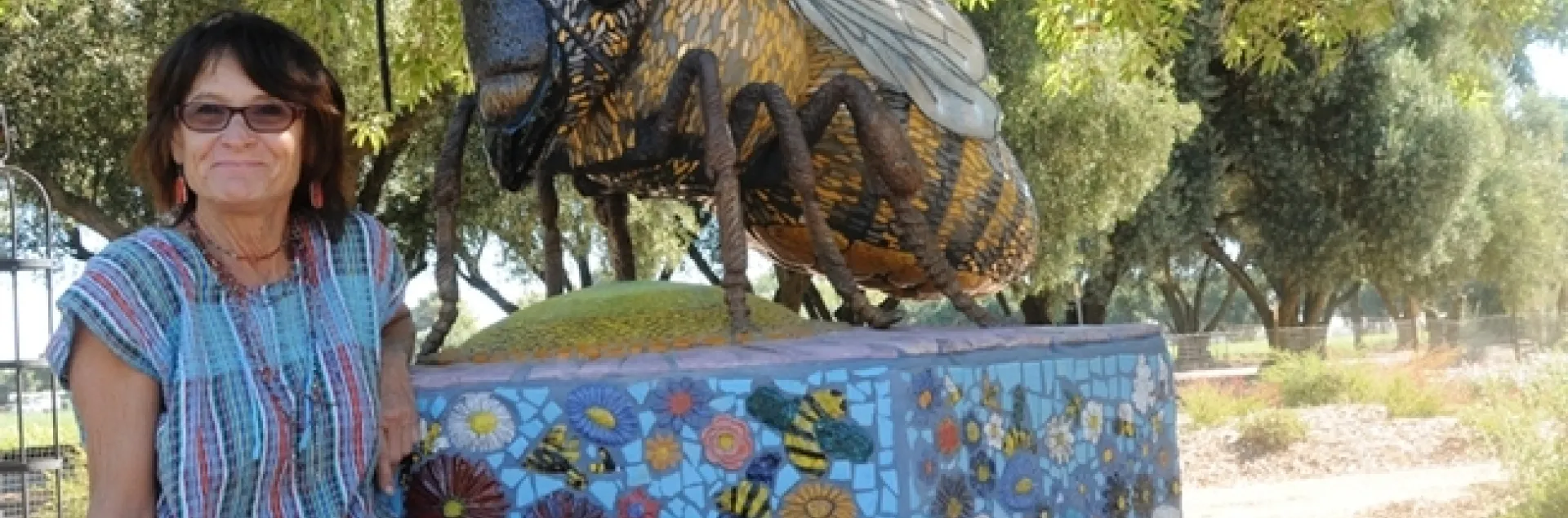 UC Davis Art/Science Fusion co-founder and co-director Donna Billick with her mosaic ceramic sculpture, Miss Bee Haven, in the half-acre Haagen-Dazs Honey Bee Haven on Bee Biology Road, UC Davis. (Photo by Kathy Keatley Garvey