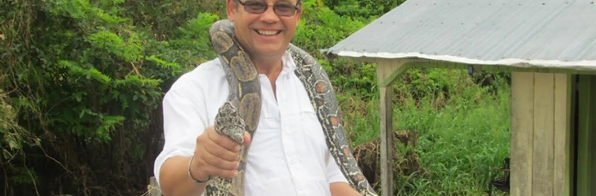 Medical entomologist Anthony Cornel with a snake in Brazil.