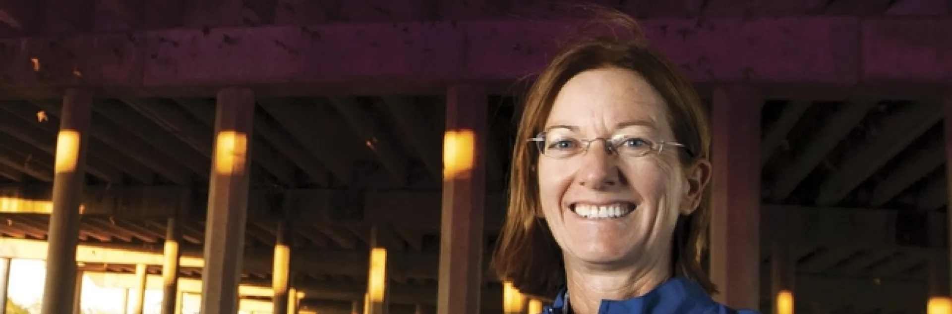 Rachael Long beneath the Yolo Causeway with a bat detector. Notice the bats in the photo. (Photo courtesy of the California Farm Bureau Federation)
