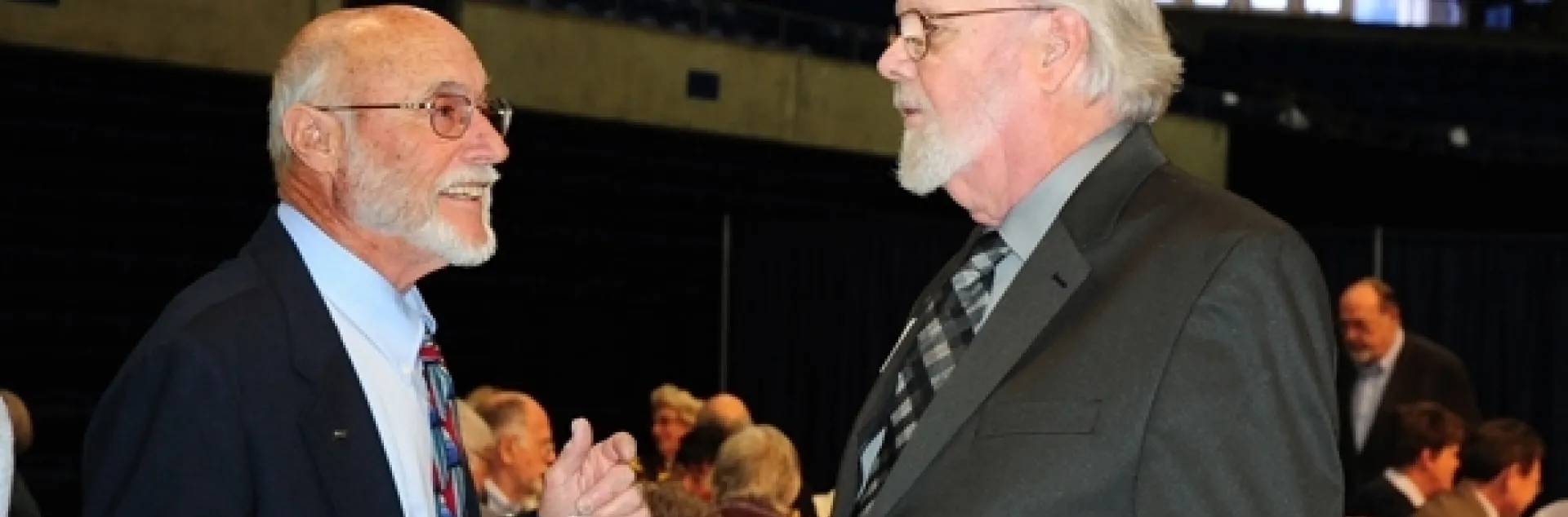 Emcee Bill Rains (left) congratulations Robbin Thorp. (Photo by Kathy Keatley Garvey)