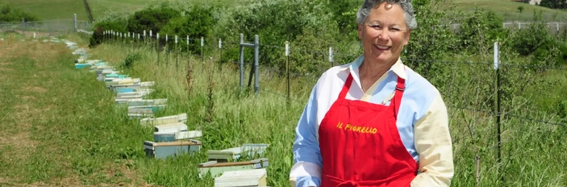 Ann Sievers stands by her bees, a new addition to IL Fiorello. This week is National Pollinator Week. (Photo by Kathy Keatley Garvey)