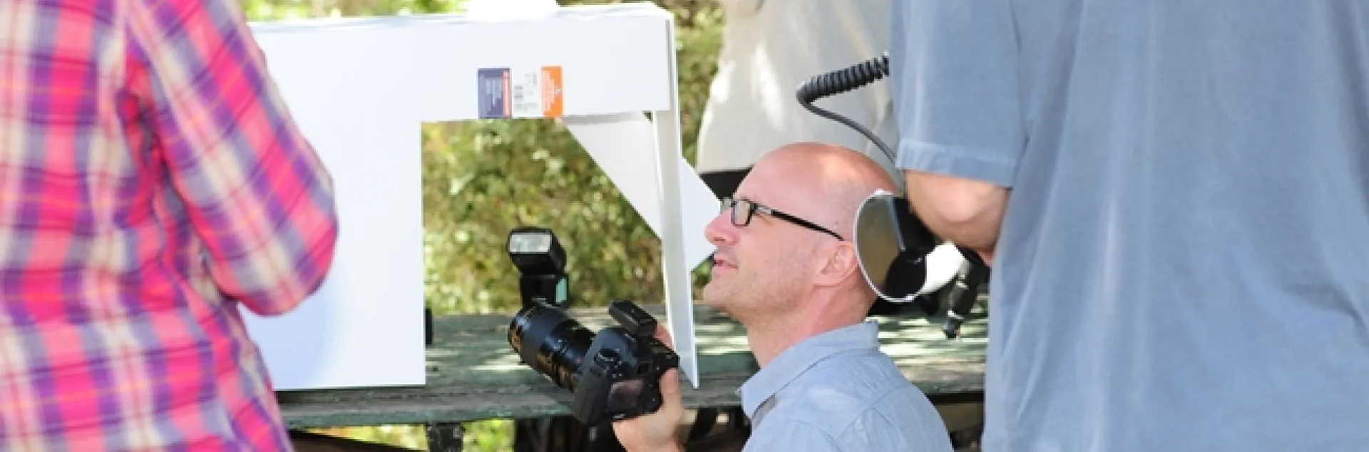 Alex Wild shows photographers some white box techniques at BugShot Hastings. (Photo by Kathy Keatley Garvey)
