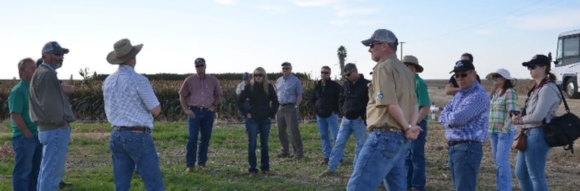 Dan Munk (light blue shirt and wide-brimmed hat at left) hosts Steve Vasquez’s TKI Crop Vitality at the long-term NRI Project study site in Five Points, CA