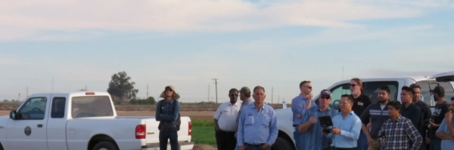 Participants at an IGIS drone workshop at Desert Research and Extension Center gain practice flying a drone.