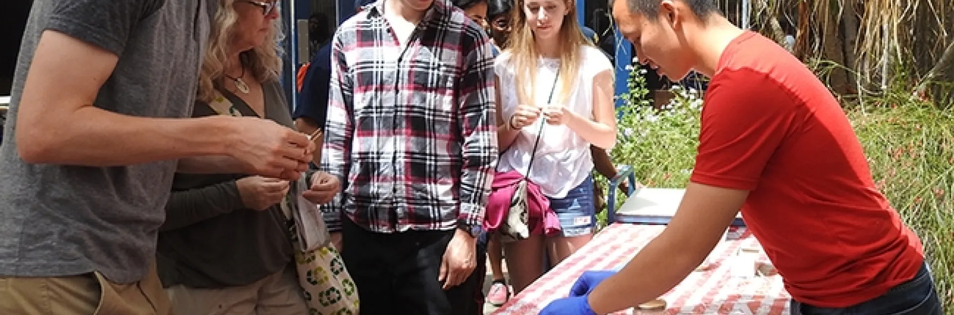 Entomology graduate student Yao Cai (right) of the Joanna Chiu lab helped staff the honey tasting table at Briggs Hall during the 2017 UC Davis Picnic Day. (Photo by Kathy Keatley Garvey)