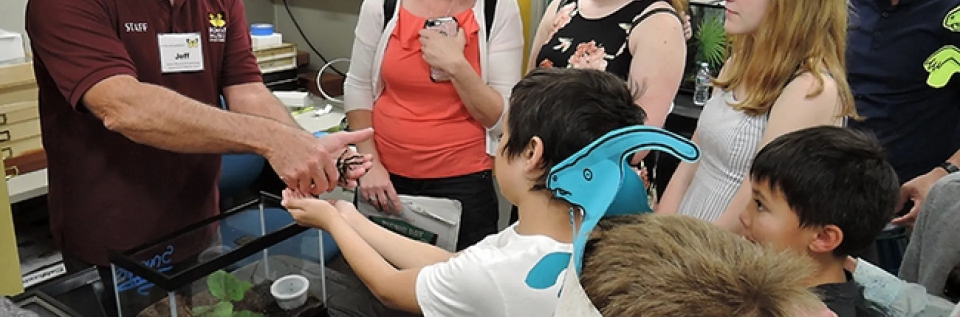 Entomologist and Bohart associate Jeff Smith introduces a crowd to Snuggles, a rose-haired tarantula. (Photo by Kathy Keatley Garvey)