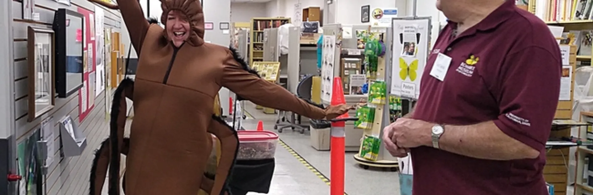 Karey Windbiel-Rojas' cockroach costume proved a crowd pleaser at the Bohart Museum of Entomology open house. Here entomologist Jeff Smith, who curates the butterflies and moths at the Bohart, gives his approval. Windbiel-Rojas, with the UC Statewide Integrated Pest Management Program (UC IPM) is the associate director for Urban and Community IPM. (Photo by Tabatha Yang)