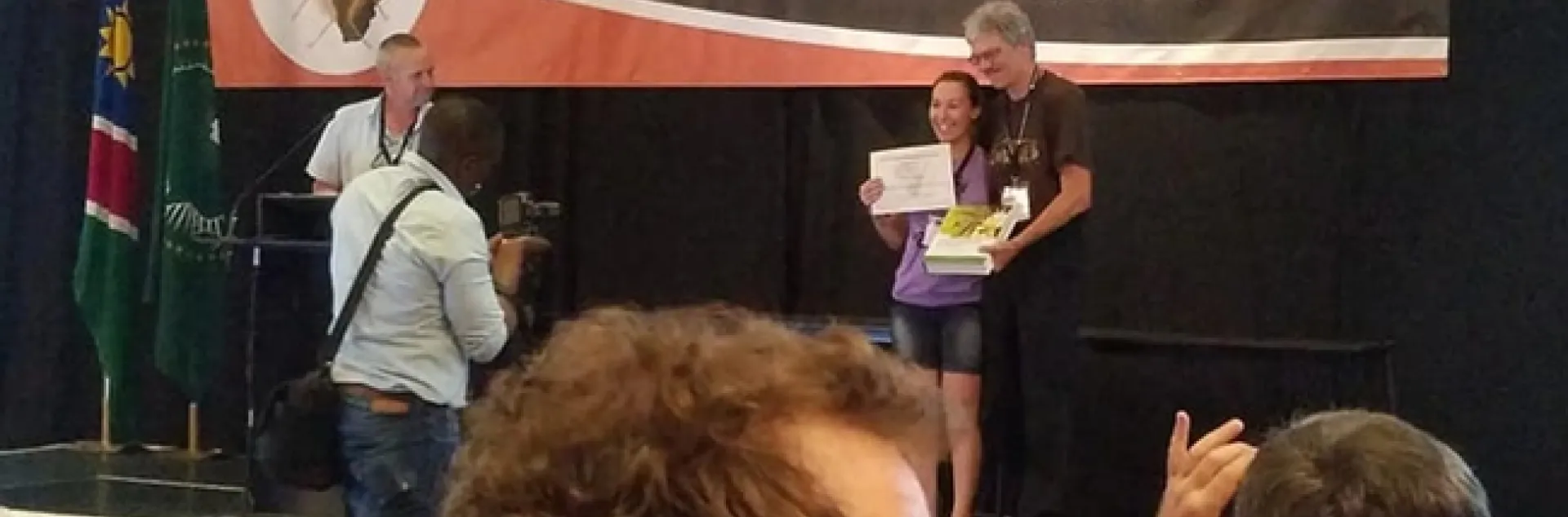 Professor Thomas Pape of the Natural History Museum of Denmark and chair of the Council for the International Congresses of Dipterology, presents the top student prize to Jessica Gillung. The next Congress takes place in 2022 in California.