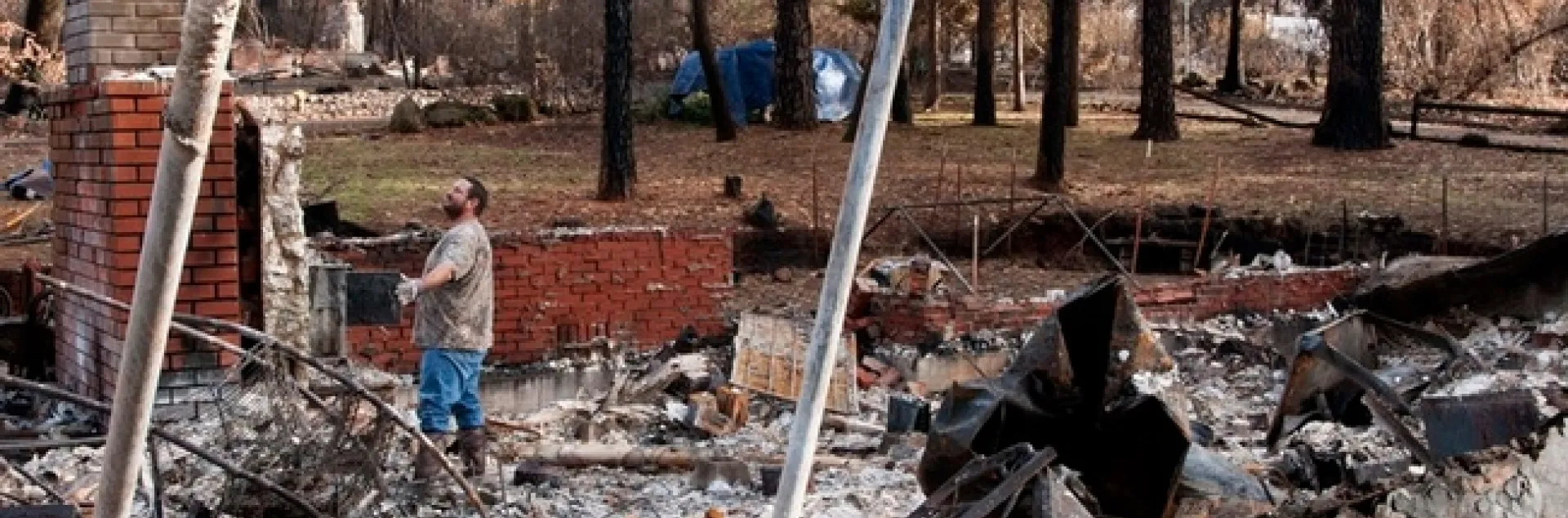 A Paradise resident surveys his home destroyed by the Camp Fire in Butte County. (Photo: 25th Air Force 25af.af.mil)