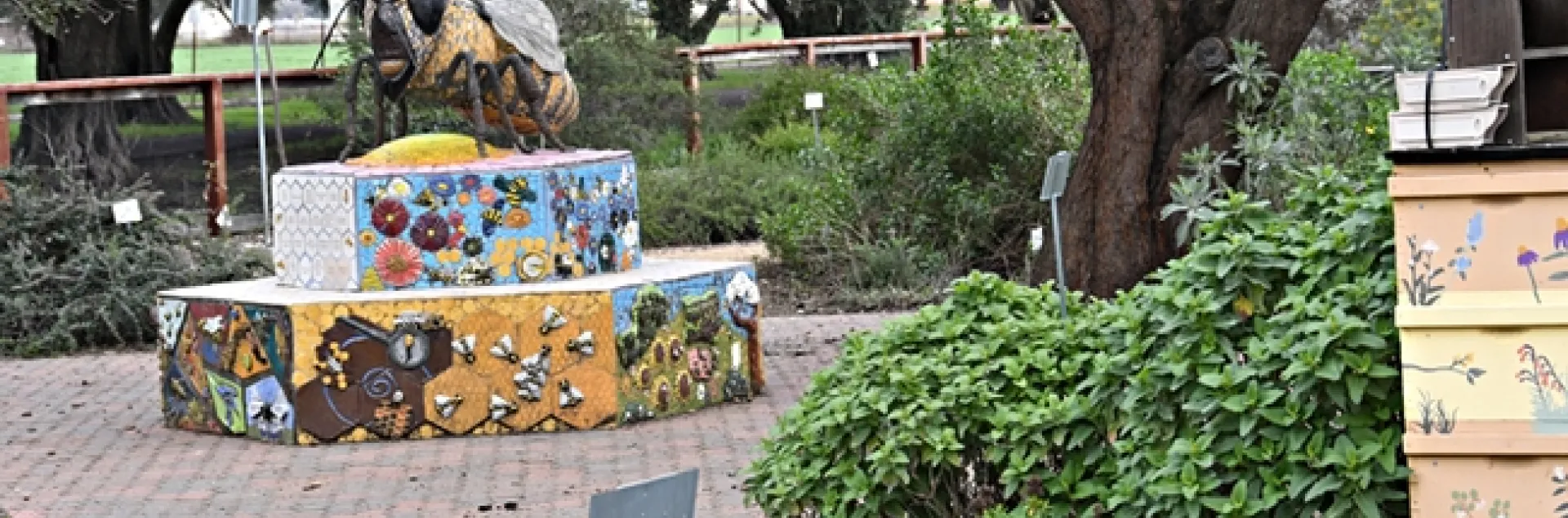 A six-foot-long mosaic and ceramic sculpture, Miss Beehaven, anchors the Häagen-Dazs Honey Bee Haven. It is the work of Donna Billick of Davis. (Photo by Kathy Keatley Garvey)