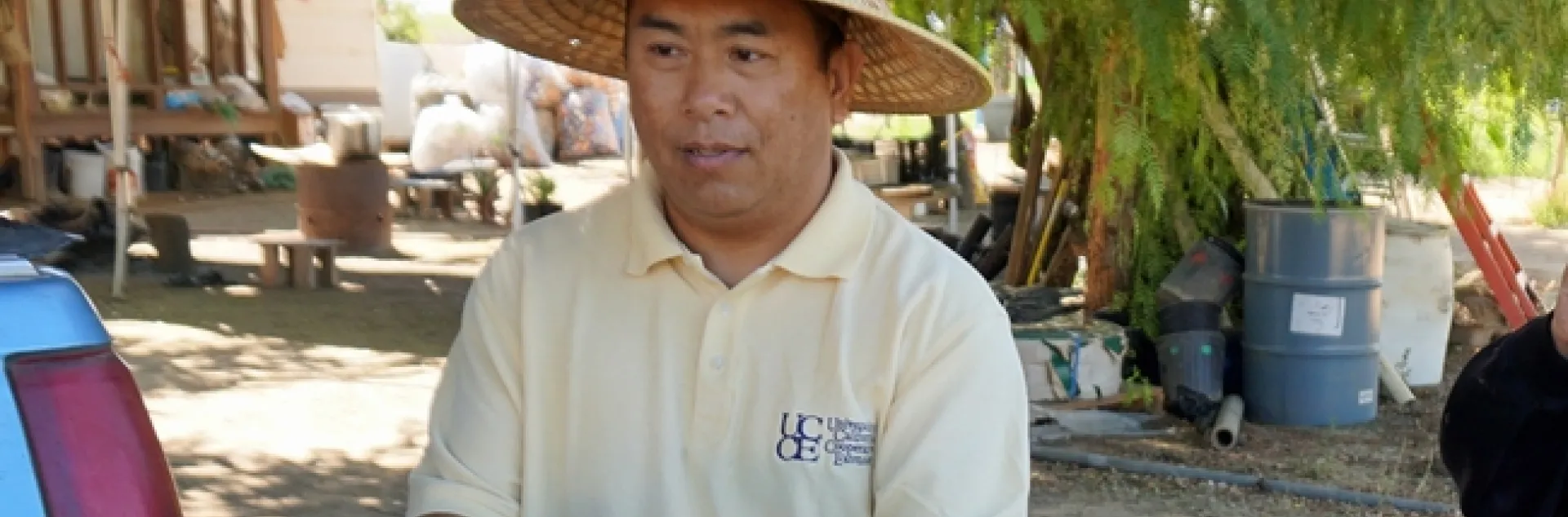 The rainy winter means sweet strawberries are on the way, says UC Cooperative Extension small farms and specialty crops Hmong ag assistant Michael Yang. The photo shows Yang with an Asian melon in summer 2018.