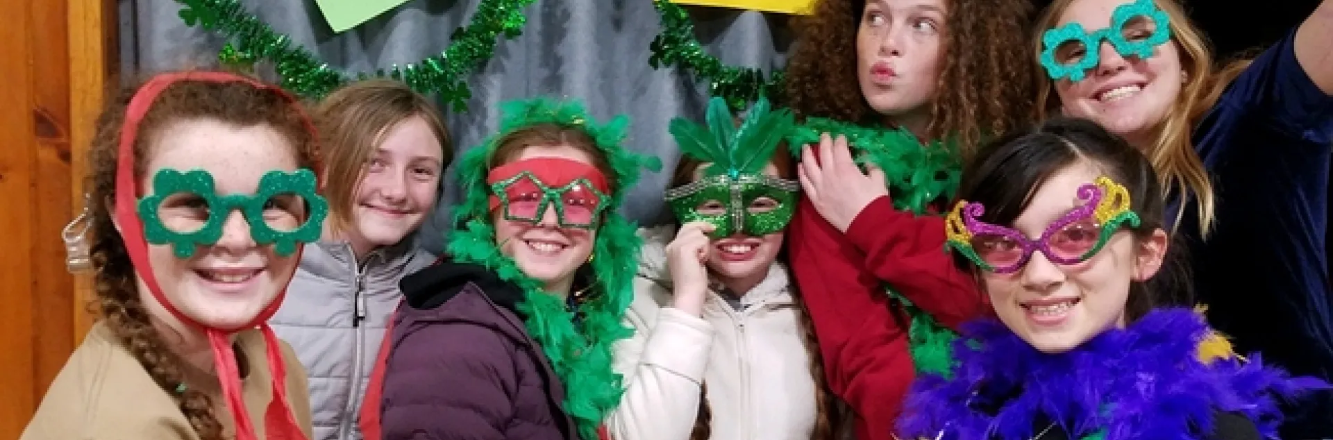 People wearing funny party glasses