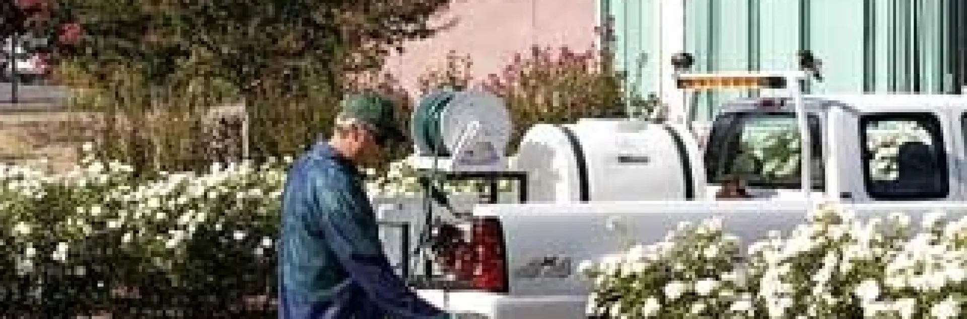 A single hose pesticide application in a landscape. (Credit: Jack Kelly Clark)