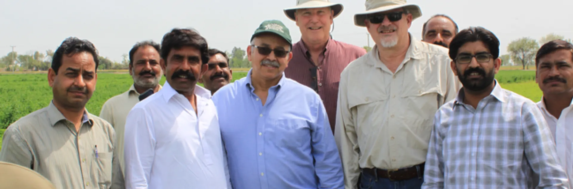 Dr.Khaled Bali (green hat), Dr.Dan Putnam (center back), and Dr.Jeff Dahlberg (tan hat and shirt) meeting with Pakistani improved forage stakeholders.