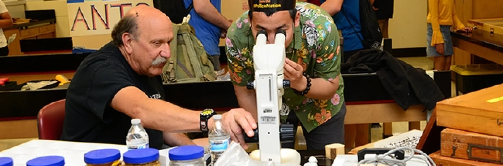 Forensic entomologist Robert Kimsey (left) held forth at the forensic entomology table in Briggs Hall during the 2019 UC Davis Picnic Day. He recently won a College of Agricultural and Environmental Sciences' advising award. (Photo by Kathy Keatley Garvey)